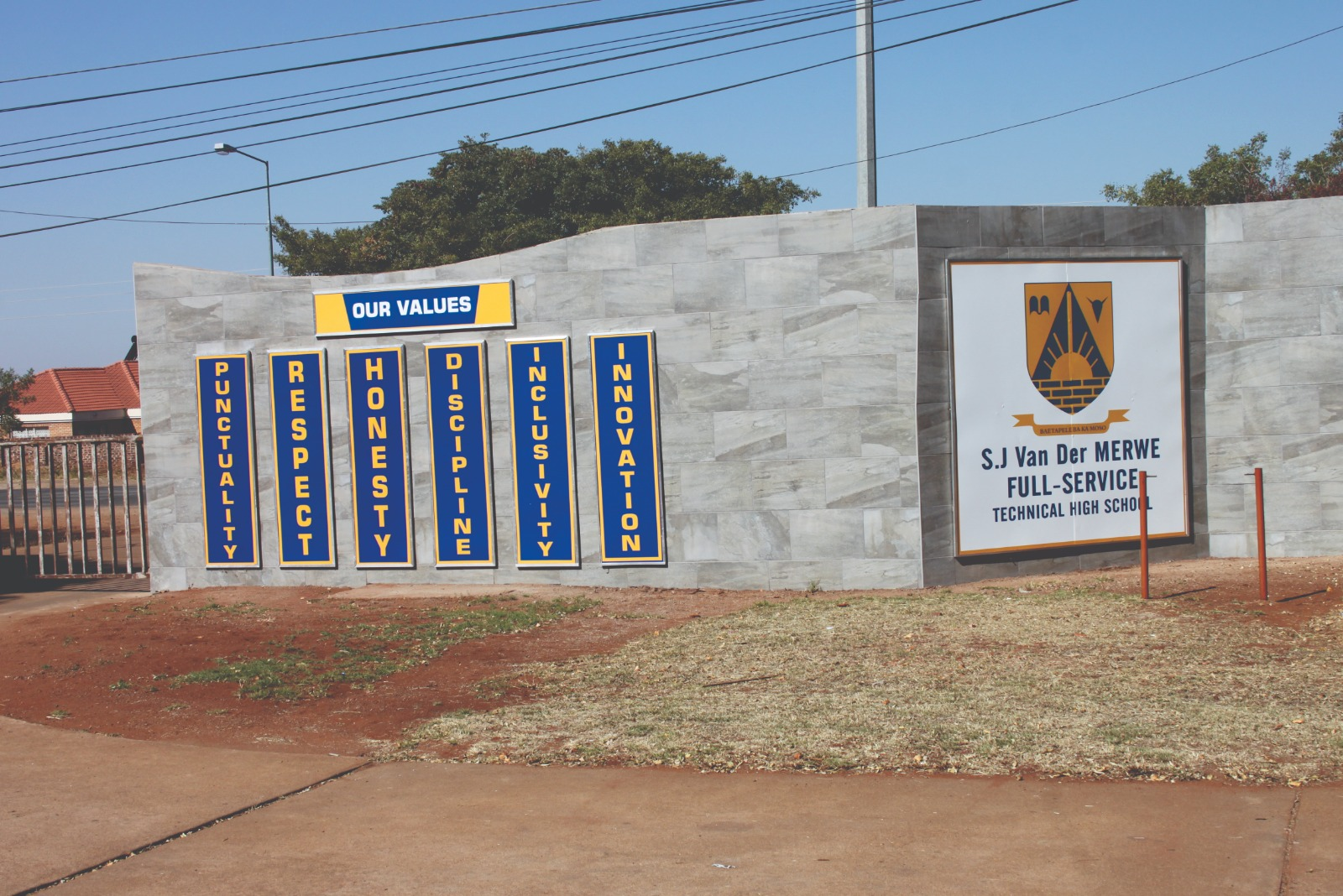 S.J Van Der Merwe Technical High School values boards mounted on the entrance wall
